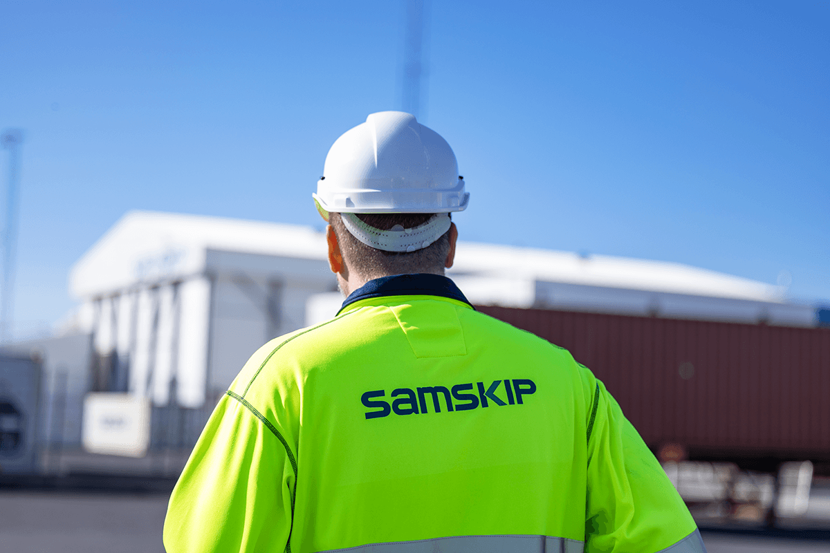 man standing in front of a Samskip warehouse in protection gear